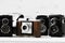 Collection old vintage retro photo cameras on white wooden background. top view, medium format