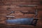 The collection of old worn tools on wooden background