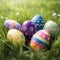A collection of painted easter eggs celebrating a Happy Easter on a spring day with green grass meadow background with copy space