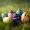 A collection of painted easter eggs celebrating a Happy Easter on a spring day with green grass meadow background with copy space