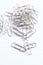 A collection of paperclips on a white surface