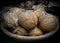 Collection of peeled coconuts for sale in the market.