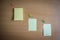 Collection of pins and note paper bunch and loose papers on wooden board. top view ready to fill your text and design quotes