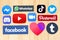 Collection of popular social media logos on wooden background