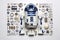 Collection of R2D2 Robot dismounted pieces organized on a white background organized