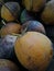 a collection of red coconuts that have been picked