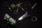 A collection of scissor, slide calipers, measuring tape, stapler and other office accessories in a dark copy space background.