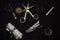 A collection of scissor, slide calipers, measuring tape, stapler and other office accessories in a dark copy space background.