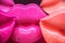 Collection of shiny lucious plastic lips in a jumbled group - closeup and colorful