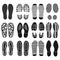 The collection of a shoeprints. Shoes silhouette black and white icons. Imprint of the soles with the differing patterns