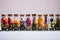 a collection of small jars containing colorful dried flowers