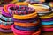 collection of stackable charity wristbands in vibrant colors