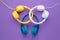 Collection of three headphones over purple background. Music concept.