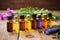 collection of various essential oils on a wooden surface