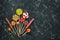 Collection of various lollipops on a black stone background. Top view, flat lay