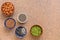 Collection of various seeds in a bowl on a brown stone background. Sesame, flax, chia, pumpkin, almonds. Top view, flat lay, copy