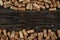 A collection of various used wine corks close-up. Plenty of sloping caps from alcoholic beverages