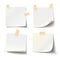 Collection of various white note papers with curled corner and adhesive tape