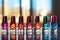 Collection of vibrant nail polish bottles on a shiny surface with a blurred background