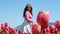 Collection of videos and photos where a girl in a white skirt walks through field with tulips blue background sky