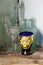 COLLECTION OF VINTAGE BOTTLES AND DECORATIVE GLASS EGG CUP ON AN OLD SHELF