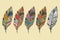 Collection of vintage tribal ethnic hand drawn colorful feathers