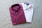 A collection of violet folded men`s shirts