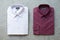 A collection of violet folded men`s shirts