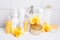 Collection of white cosmetic bottles and hygiene supplies with o