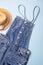 Collection of womens  summer clothes  and accessories  collage on blue. Jeans overall and wicker hat, flat lay,