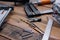 Collection of woodworking tools on a wooden background