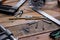 Collection of woodworking tools on a wooden background