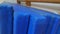 A collection of worn blue gymnastics mats