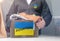 Collects clothes donations for Ukrainian refugees, support for Ukraine, humanitarian aid. Donation box with donation clothes on a