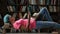 College female student studying hard in library