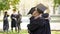 College graduates having conversation, hugging each other, university friendship