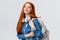 College life, modern lifestyle and education concept. Cheerful good-looking redhead female student with foxy long hair