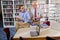 College professor with student talking in library