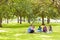 College students sitting on grass in park