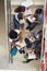 College students sitting on staircase at school and studying