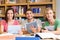 College students using digital tablets in library