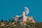 Collioure, France. moon moonrise above Fort Saint Elme In Sunny Spring Day. Old Medieval Fortress Saint-elme Is A