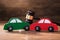 Collision Of Wooden Two Toy Cars In Front Of Gavel