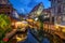 Colmar, France. Half-timbered houses and verandas of restaurants reflecting in the water
