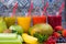 Colofrul fresh pressed fruit juices in tall glasses with fruits