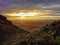 A colofrul sunrise seen from a small hill in the suburbs of Xilinhot, Inner Mongolia. The sky is painted in orange, red