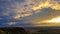 A colofrul sunrise seen from a small hill in the suburbs of Xilinhot, Inner Mongolia. The sky is painted in orange, red