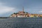 Coloful Rovinj contrasts with the darkening sky