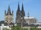 Cologne Cathedral rises above the roofs of houses 6154