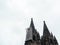 Cologne Cathedral with scaffold against cloudy sky